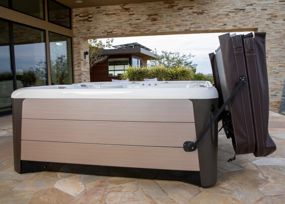 Affordable hot tub with cover lifter on patio