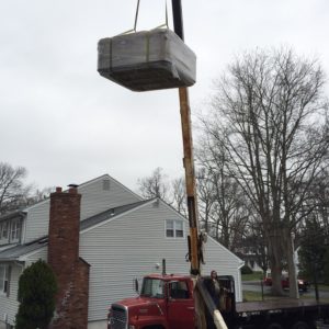 crane delivery over house